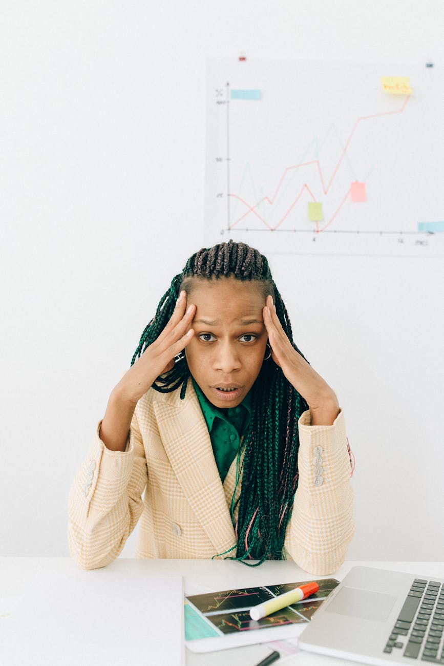 photo of a woman with her hands on her head